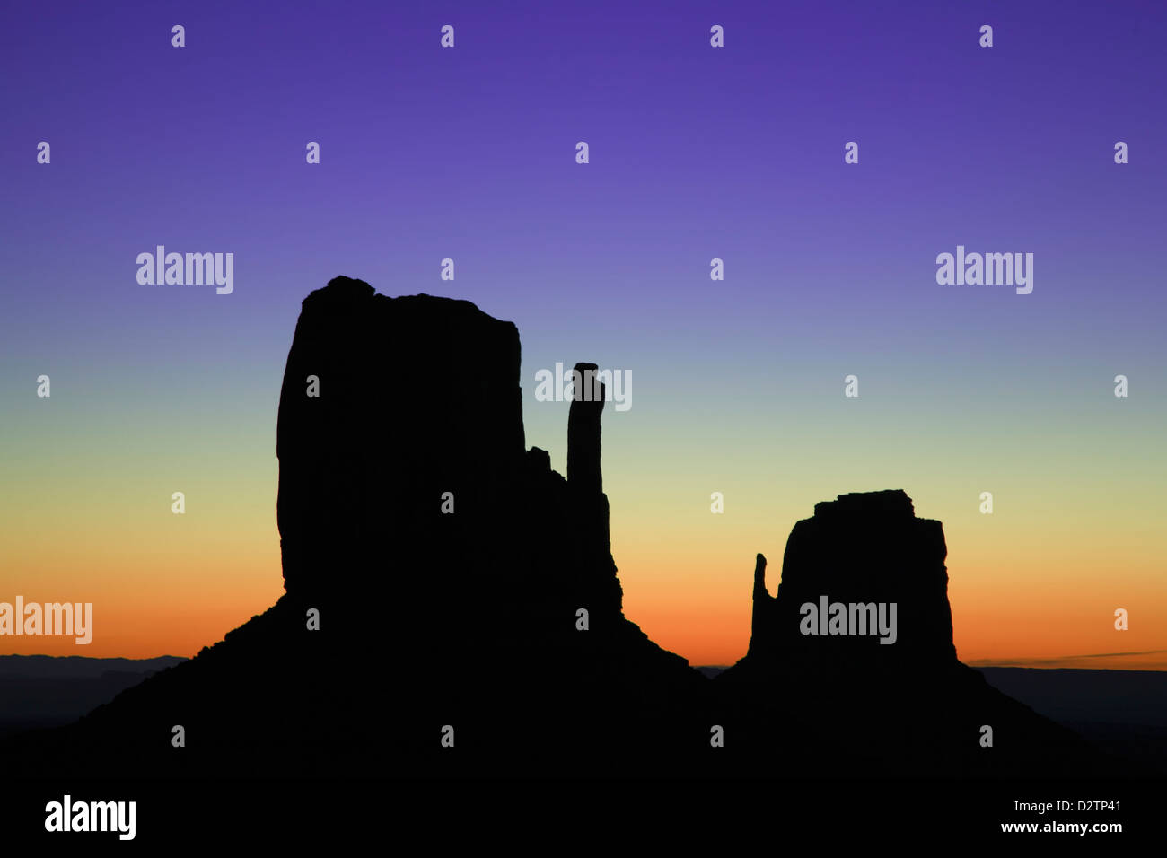 The Mittens silhouetted against morning sky, Monument Valley, Arizona Utah border USA Stock Photo