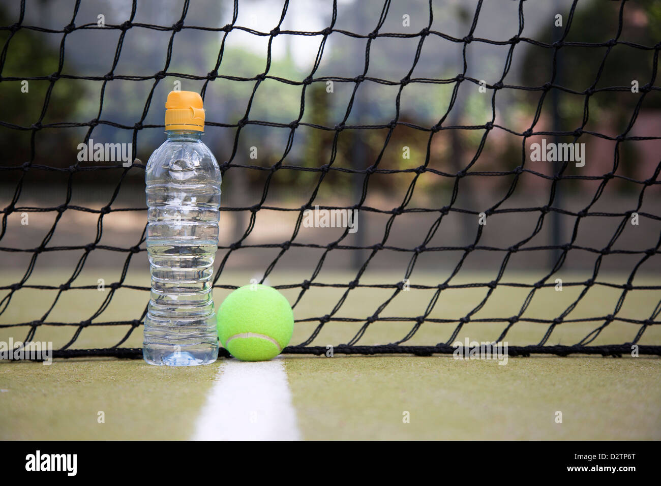 Download Bottle Of Water And Yellow Tennis Ball On The White Line Next To The Stock Photo Alamy Yellowimages Mockups