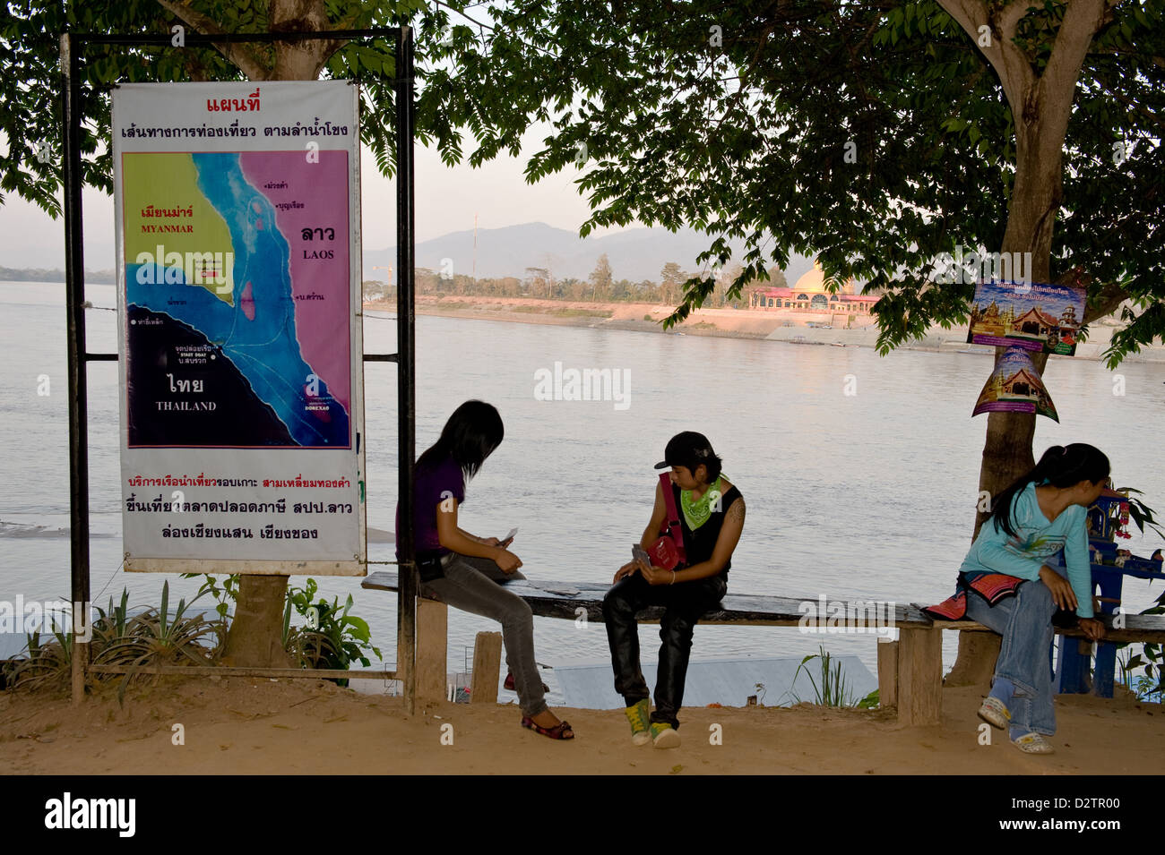 Sop Rauk Sop Ruak, Thailand, visitors play cards next to them an overview map of ...