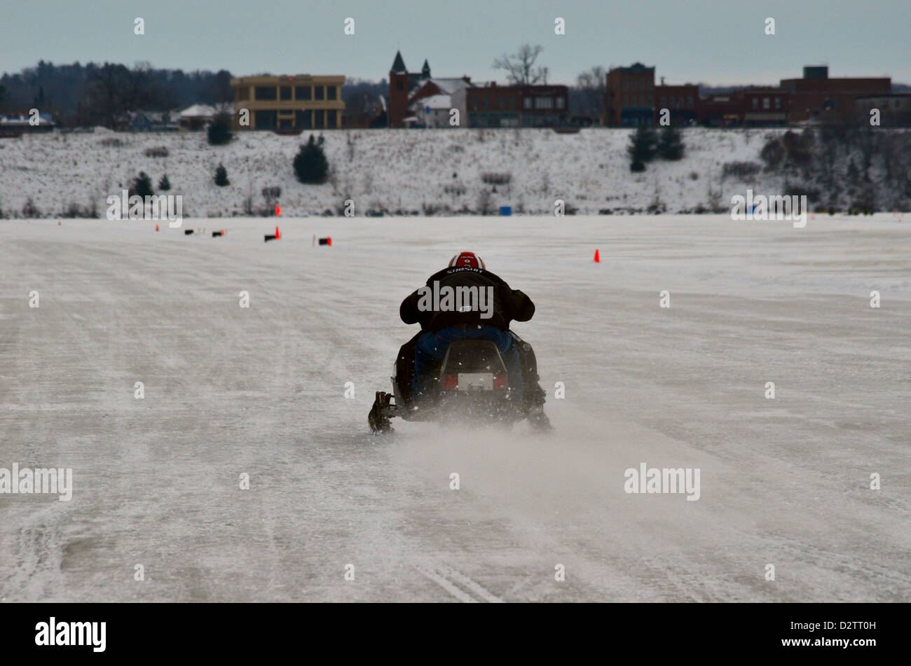 Snowmobile speed racing on frozen Lake Menomin, WI Stock Photo