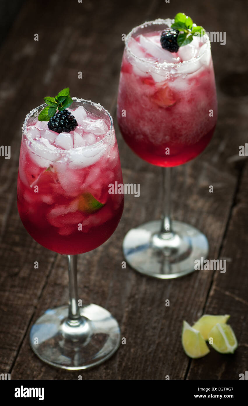 Refreshing summer alcoholic beverages with fruit and mint Stock Photo