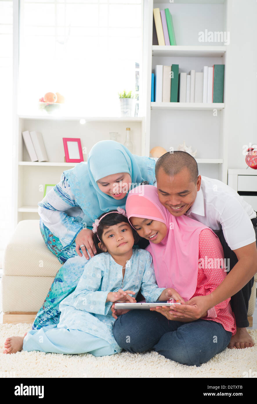 indonesian malay family having a good time surfing internet Stock Photo