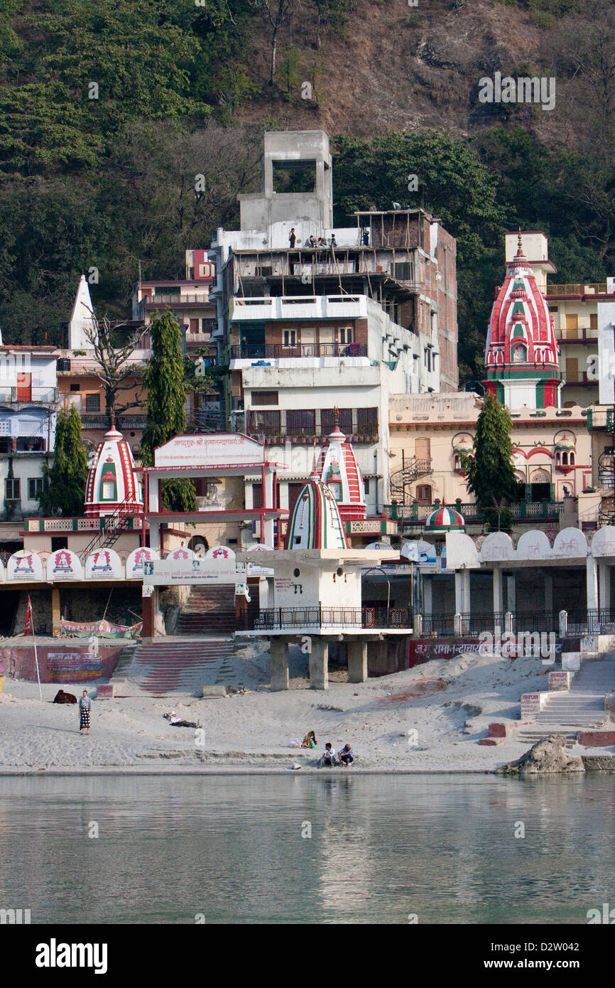 India, Rishikesh. North Bank of Ganges (Ganga), Showing Temples and Guest Houses. Stock Photo
