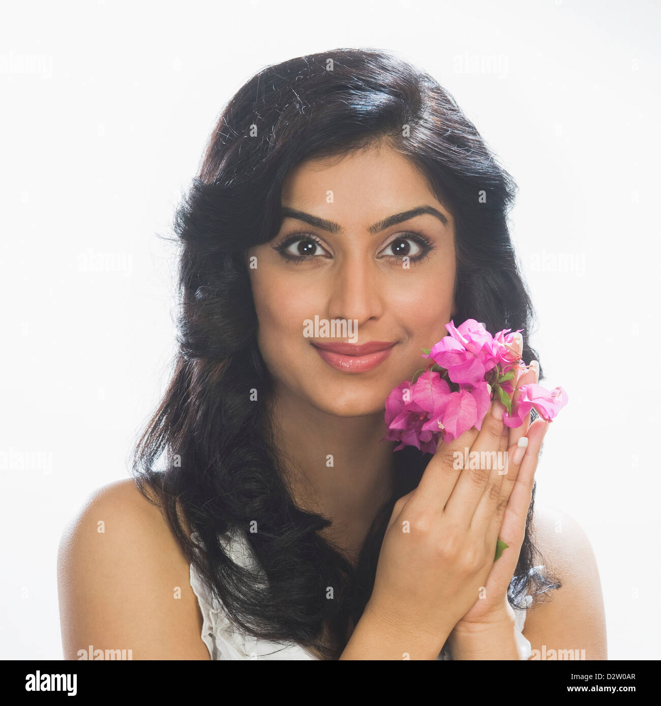Portrait of a woman holding flowers Stock Photo - Alamy