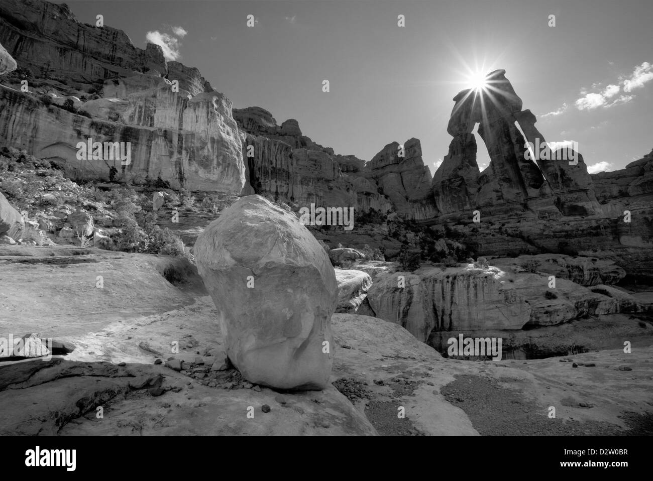 UT00232-00...UTAH - Sun coming over Druid Arch in the Needles District of Canyonlands National Park. Stock Photo