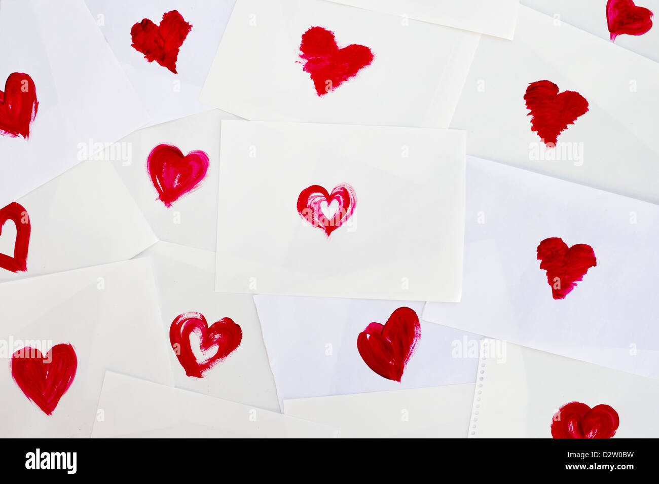 Painted red love hearts on white background Stock Photo - Alamy