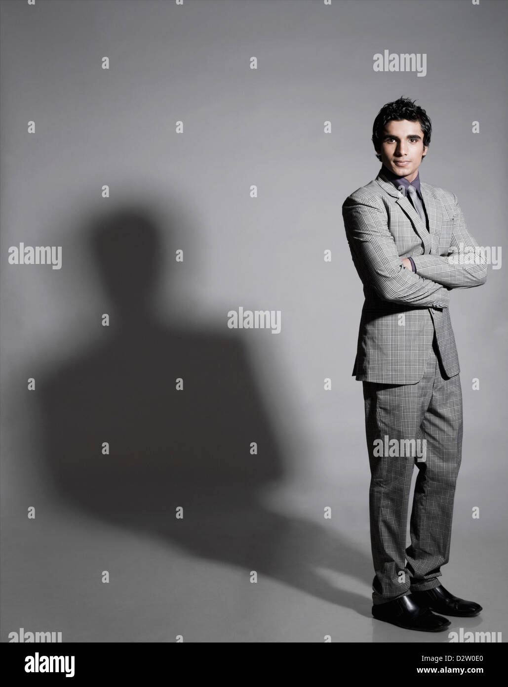Portrait of a businessman standing with his arms crossed Stock Photo ...