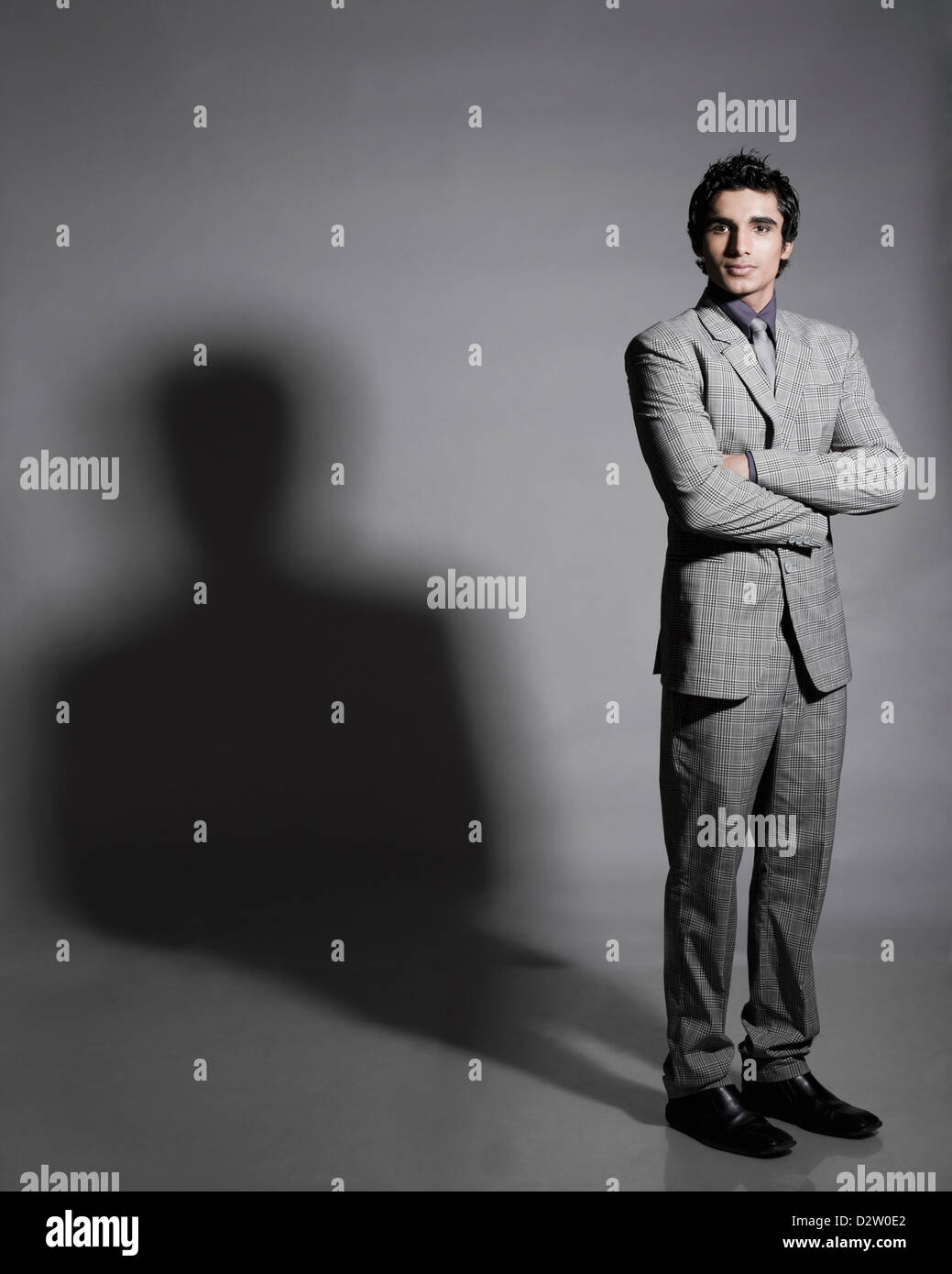 Portrait of a businessman standing with his arms crossed Stock Photo ...