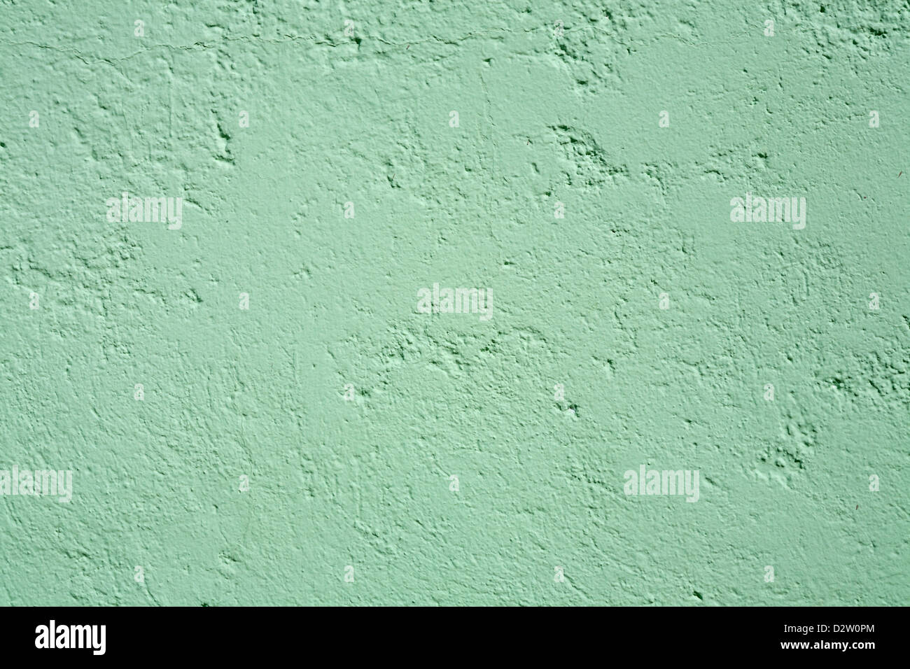 Close up detail of vertical wall showing texture of blue green painted slightly pitted surface Stock Photo