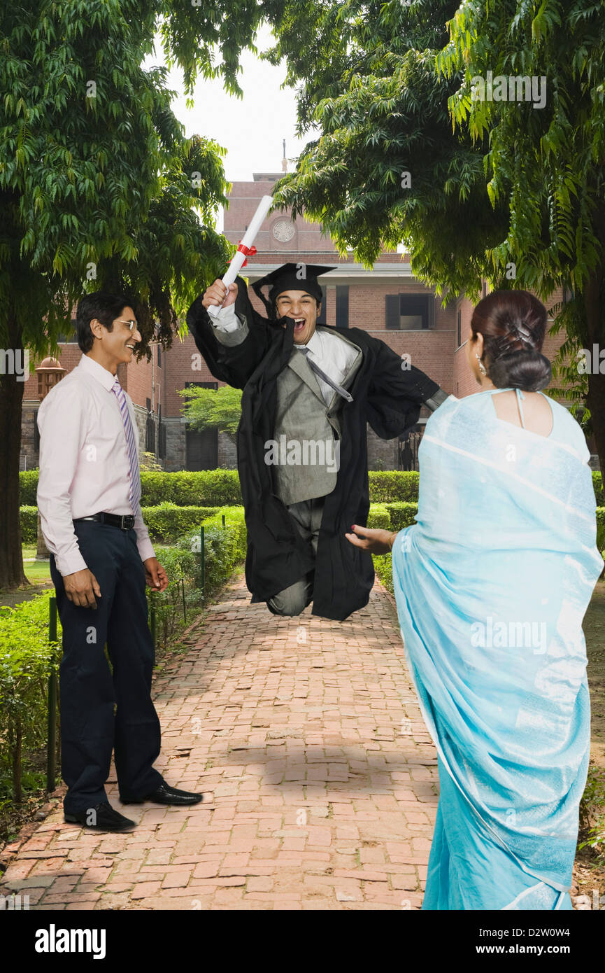 University Student Celebrating After Getting His Diploma Stock Photo