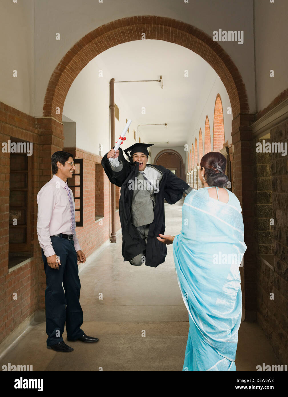 University Student Celebrating After Getting His Diploma Stock Photo