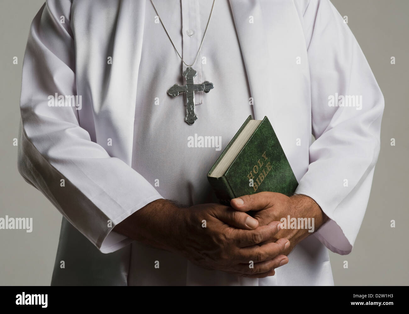 Man holding cross necklace hi-res stock photography and images - Alamy