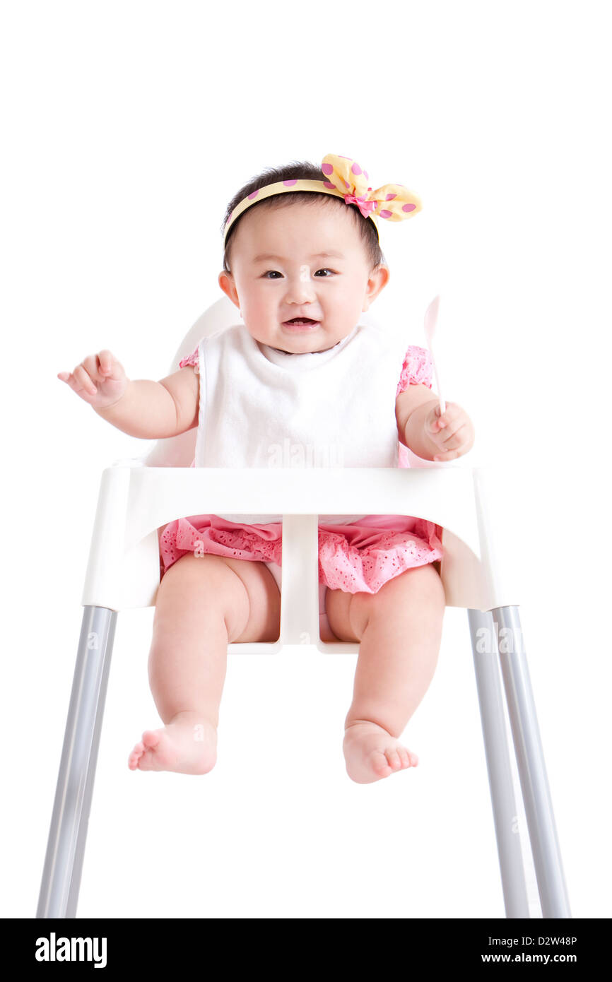 Happy baby girl on baby high chair Stock Photo Alamy