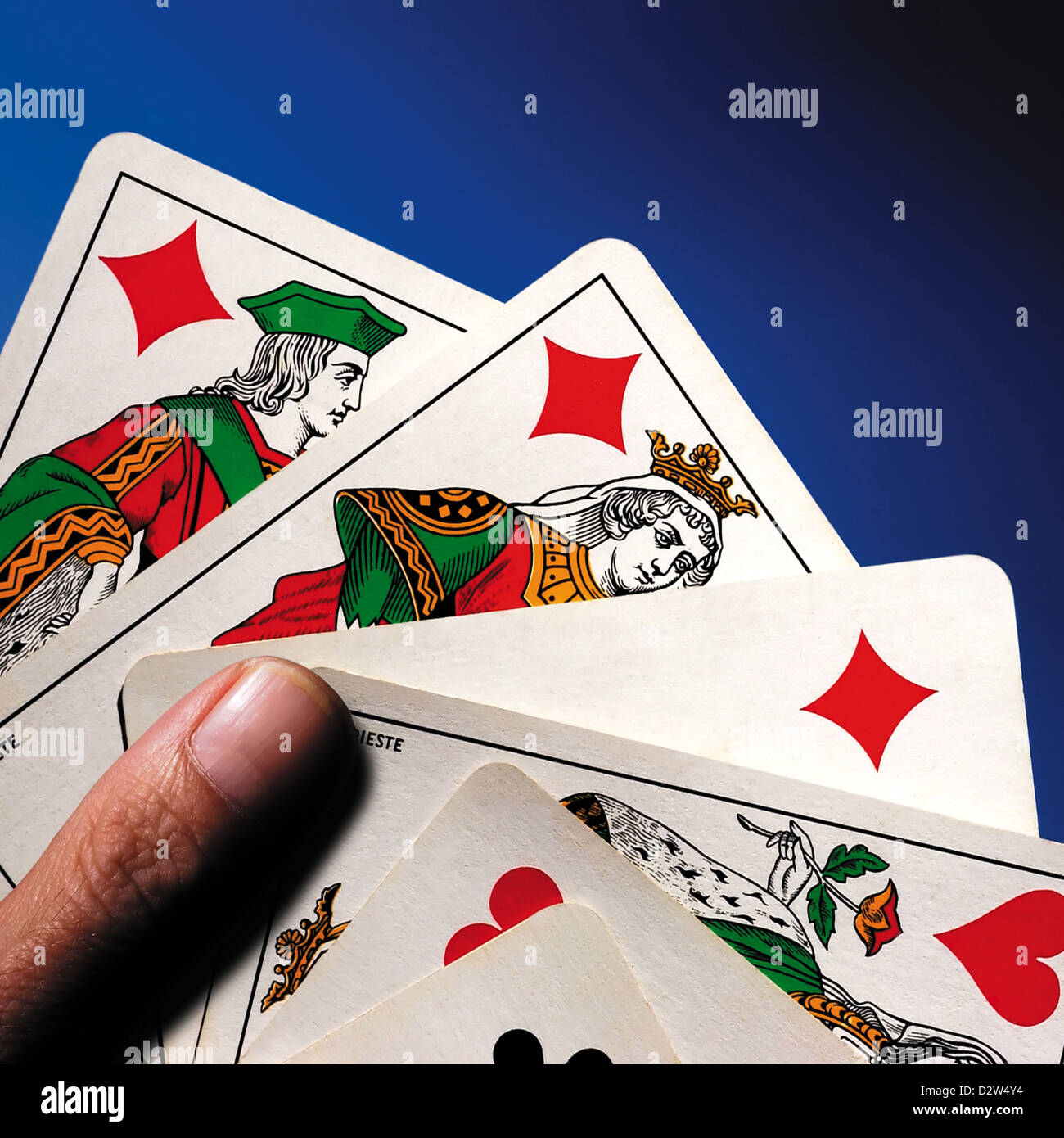 Hand holding five playing cards Stock Photo