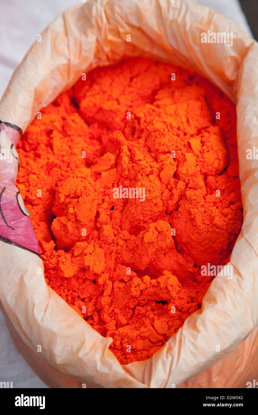 India, Rishikesh. Orange powder for tikka (tilaka), usually a dot worn on the forehead just above the bridge of the nose. Stock Photo