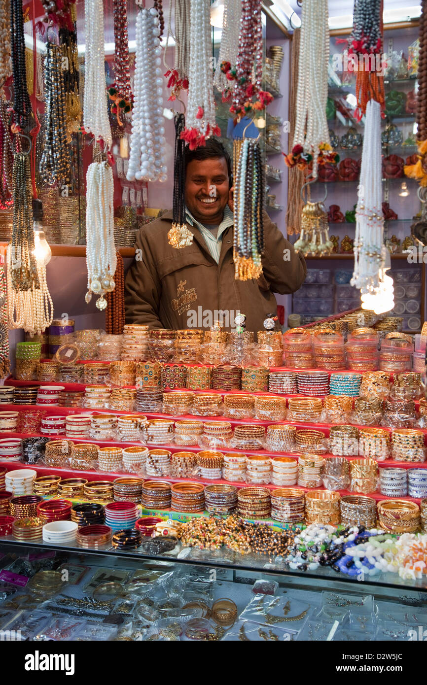 India, Rishikesh. Jewelry Shop Vendor with Bracelets and Necklaces. Stock Photo