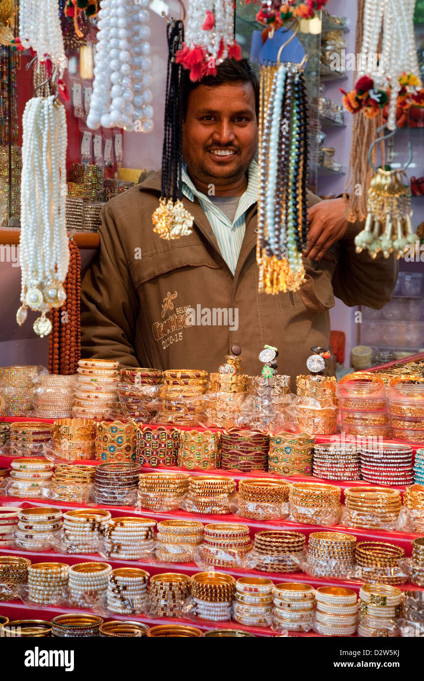 India, Rishikesh. Jewelry Shop Vendor with Bracelets and Necklaces. Stock Photo