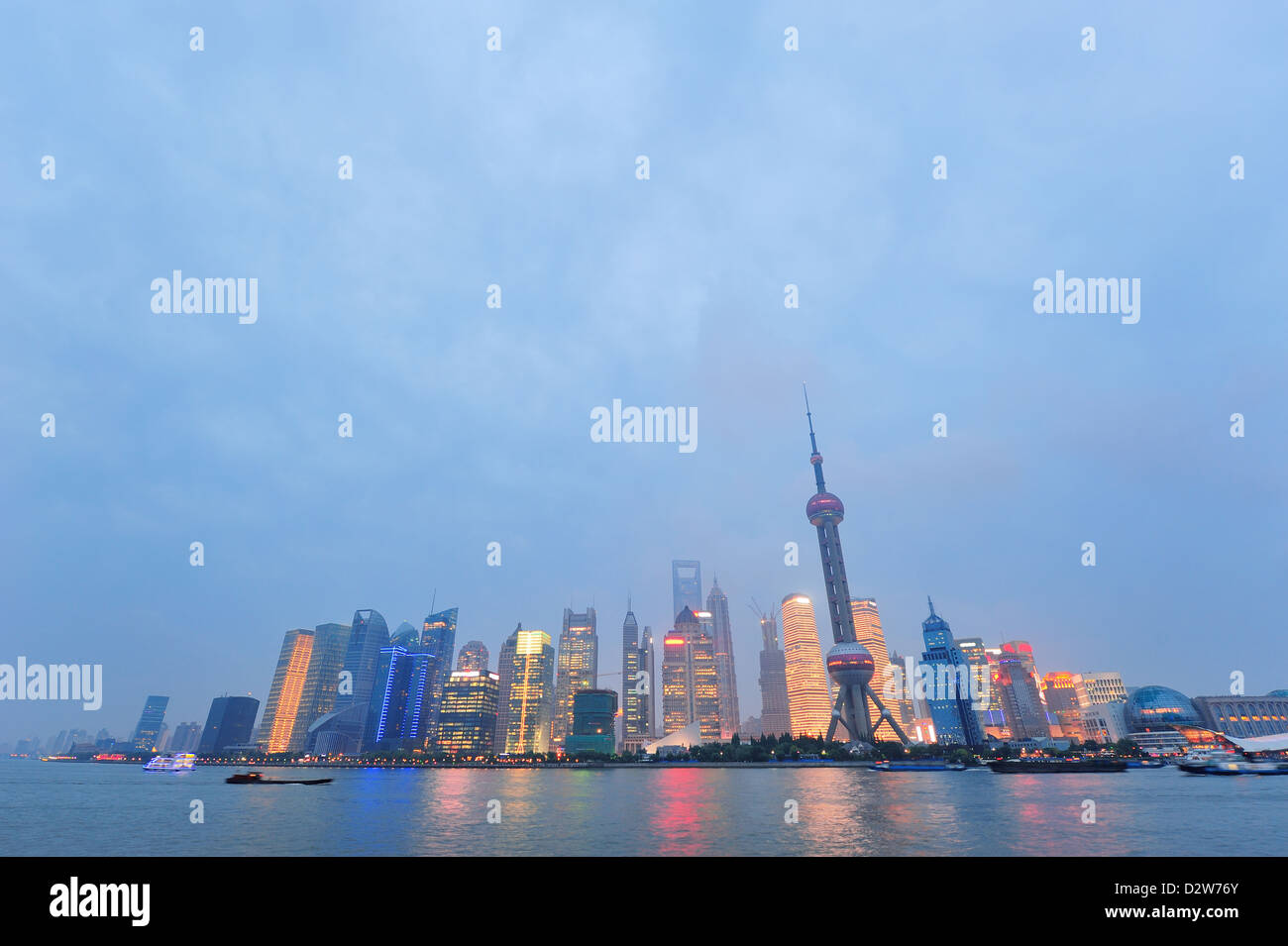 Shanghai city skyline at night over Huangpu river Stock Photo - Alamy