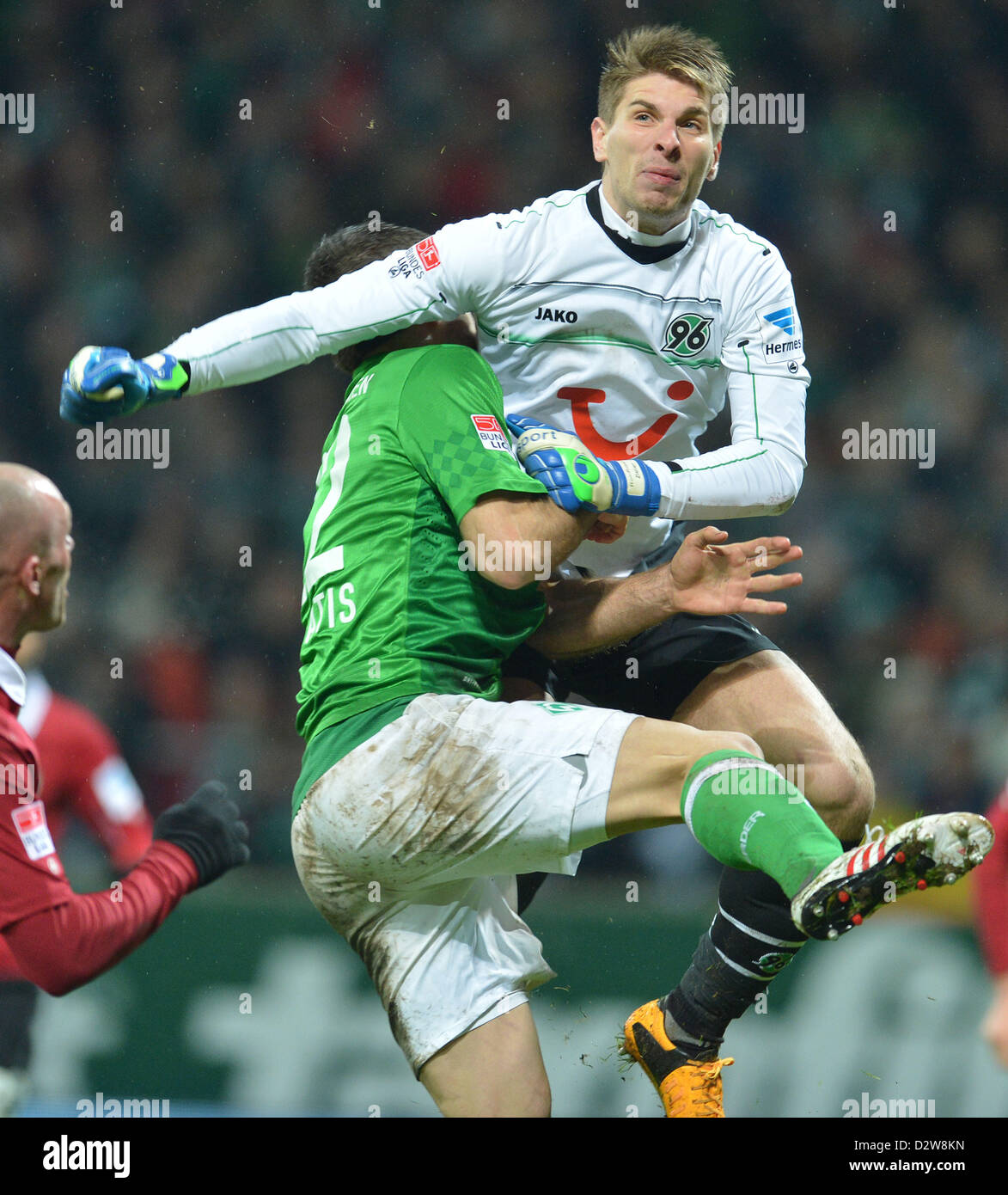 Werder's Sokrates (L) vies for the ball wth Hannover's goalkeeper Ron-Robert Zieler during the Bundesliga soccer match between Werder Bremen and Hannover 96 at Weser Stadium in Bremen, Germany, 01 February 2013. Photo: Carmen Jaspersen Stock Photo