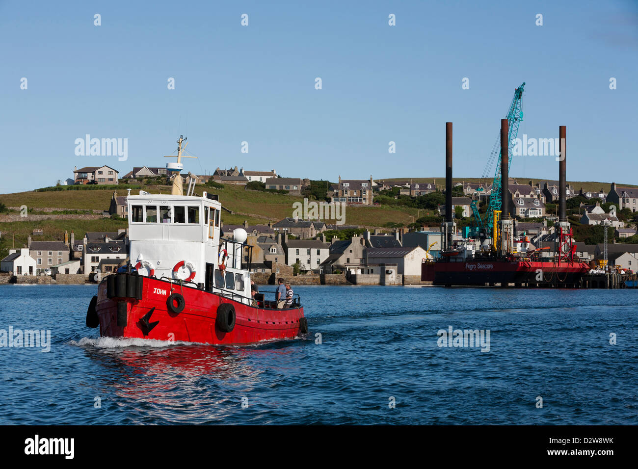 The dive boat, 'John L' heads out of Stromness harbour on it's way to Scapa Flow, Orkney Islands Stock Photo