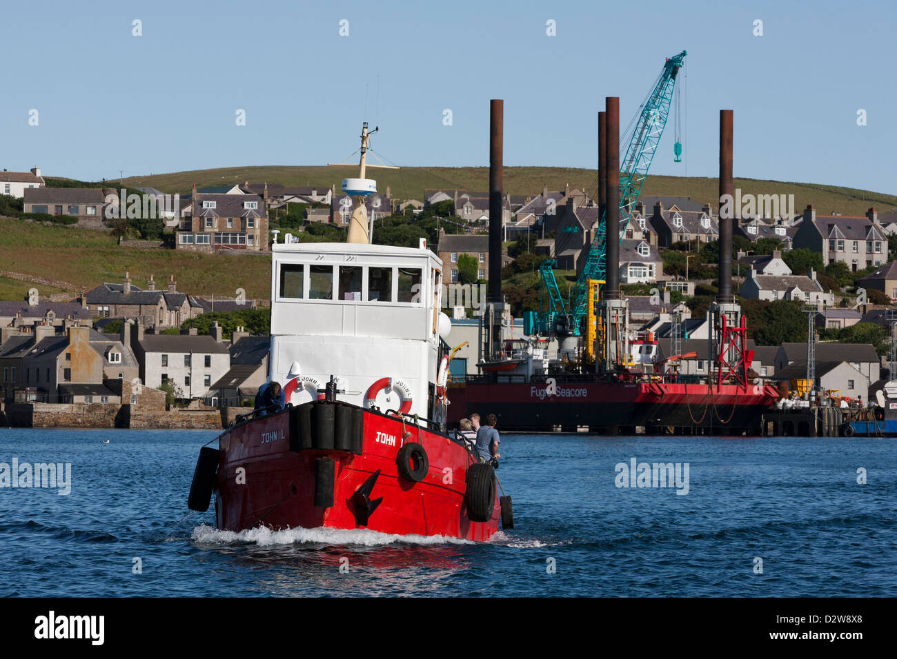 The dive boat, 'John L' heads out of Stromness harbour on it's way to Scapa Flow, Orkney Islands Stock Photo