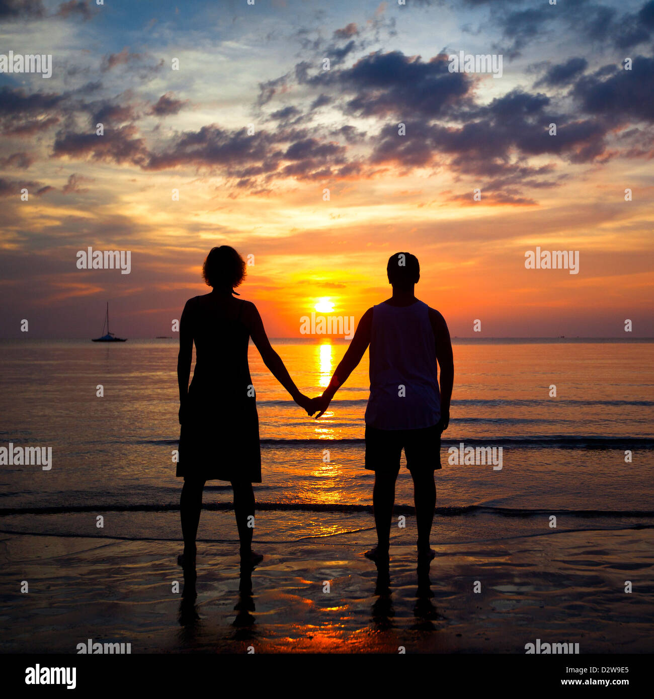 Silhouettes young couple on the beach at sunset, romantic picture Stock ...