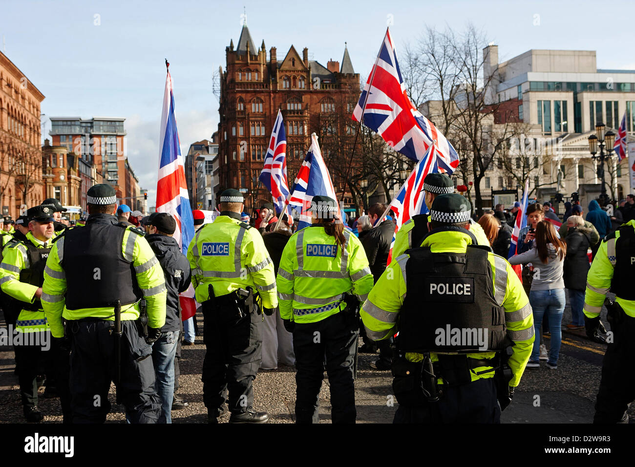 PSNI police officers line at ongoing protests against Belfast City Council's decision to only fly the Union Flag on designated days. Belfast City Centre, Stock Photo