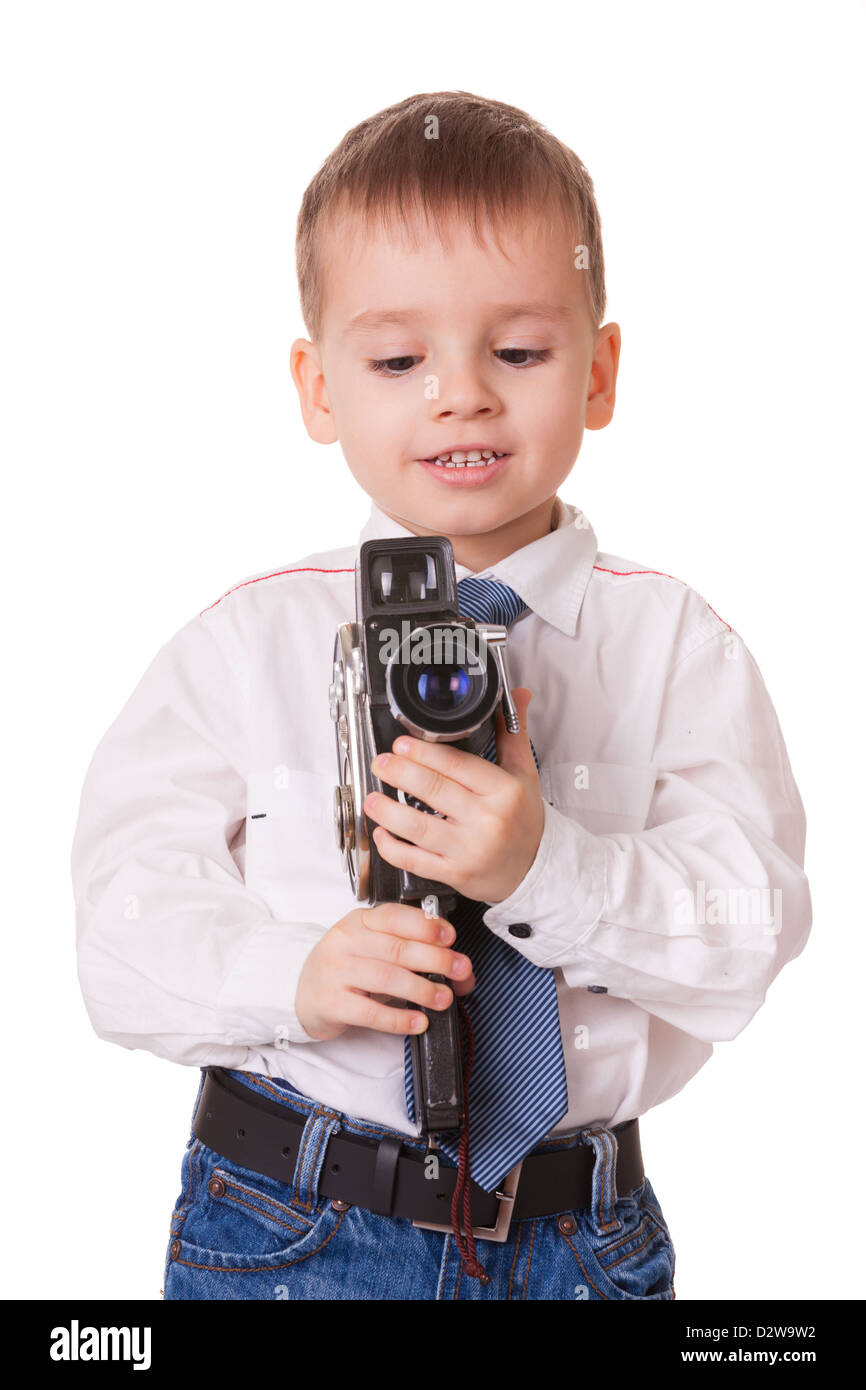 Clever small boy with vintage video camera isolated on white background Stock Photo