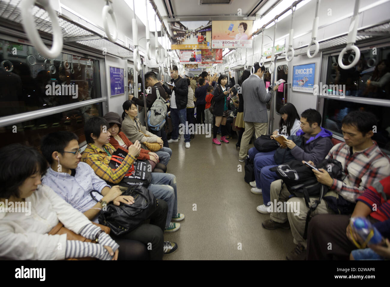 Japanese passengers sitting in metro, Tokyo, Japan Stock Photo Alamy