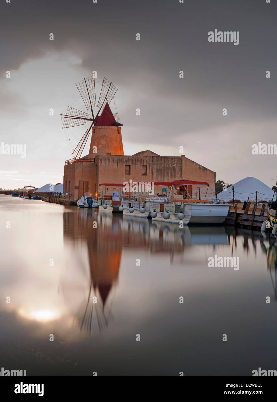 Windmill at Infersa Salt Pans in Marsala, Sicily, Italy. Stock Photo