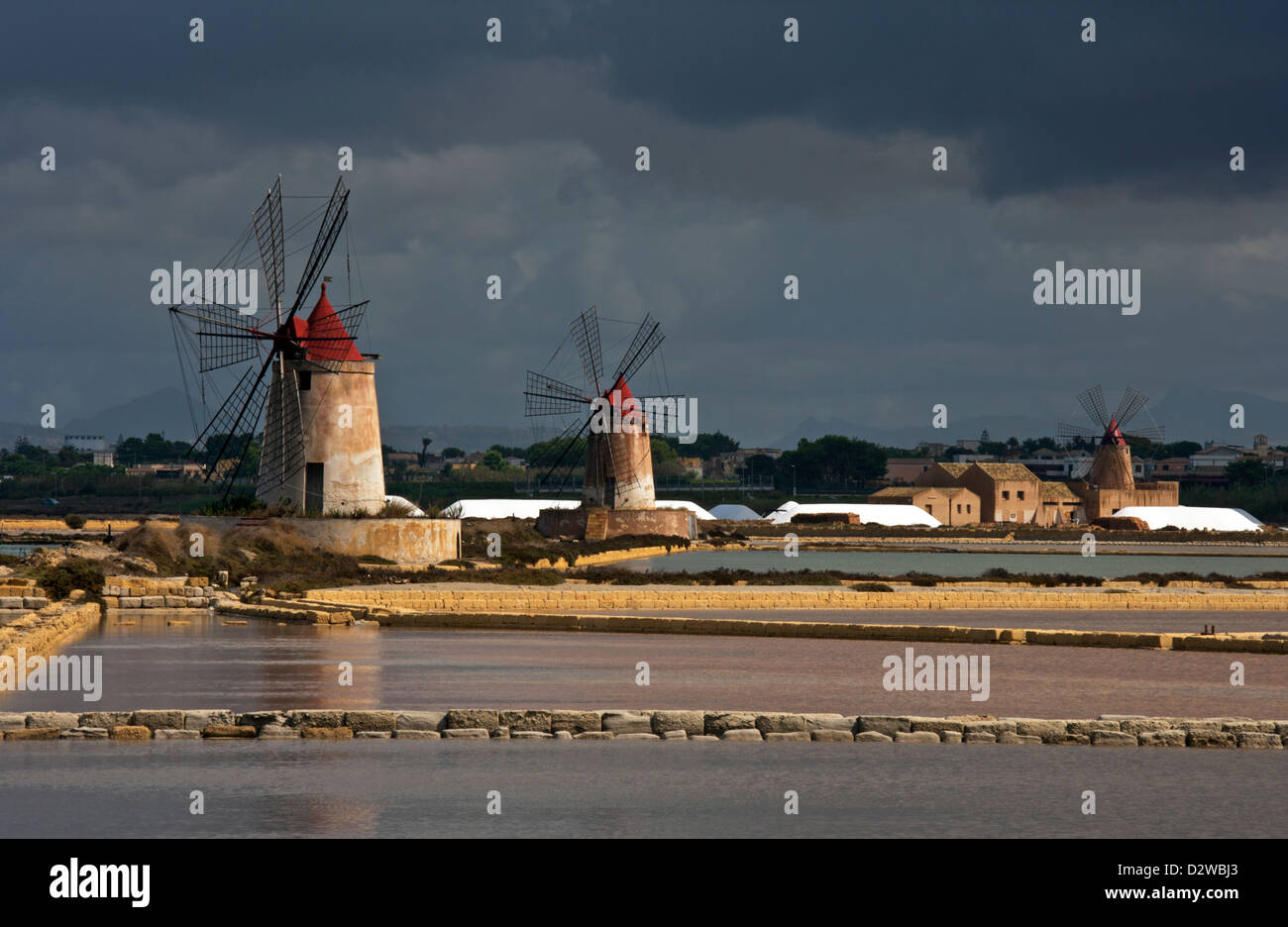 Windmills at Infersa Salt Pans in Marsala, Sicily, Italy. Stock Photo