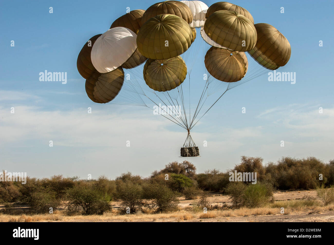 (HANDOUT) A handout provided by the French Army from the French Army Communications Audiovisual Office (ECPAD) shows paratroupers jumping out of an aircraft and landing in Timbuktu, Mali, 29 January 2013. The paratroupers will prepars a landing stip there. The French Army has penetrated areas further north in the country during the conflict with Islamic rebels in Mali. Photo: PHOTO: OLIVIER DEBES/ECPAD/HANDOUT (HANDOUT EDITORIAL USE ONLY) Stock Photo
