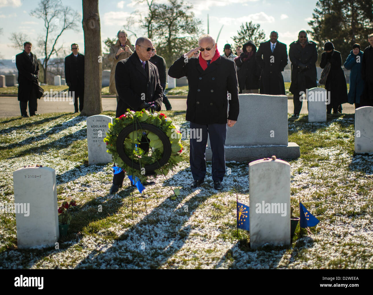 Apollo 11 astronaut Buzz Aldrin salutes as NASA Administrator Charles Bolden looks on during a wreath laying ceremony as part of NASA's Day of Remembrance February 1, 2013 at Arlington National Cemetery, Arlington, VA.  Wreathes were laid in memory of those men and women who lost their lives in the quest for space exploration. Stock Photo