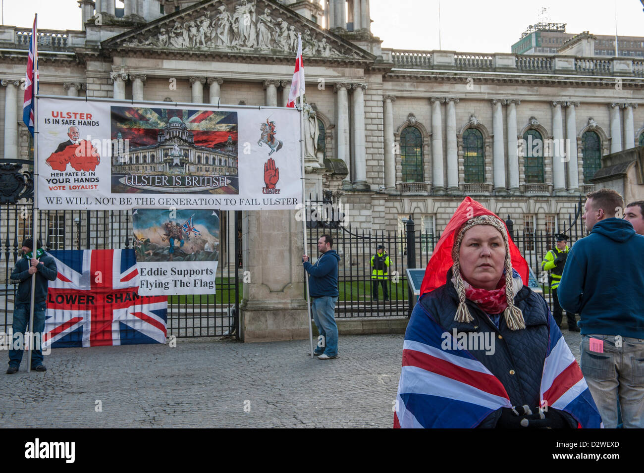 Protestors stand in front of Belfast City Hall, Northern Ireland, UK on