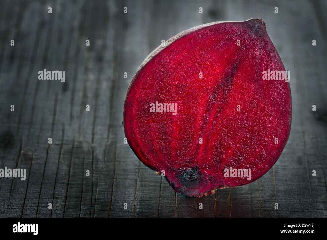 Closeup of red beet on dark wooden background Stock Photo