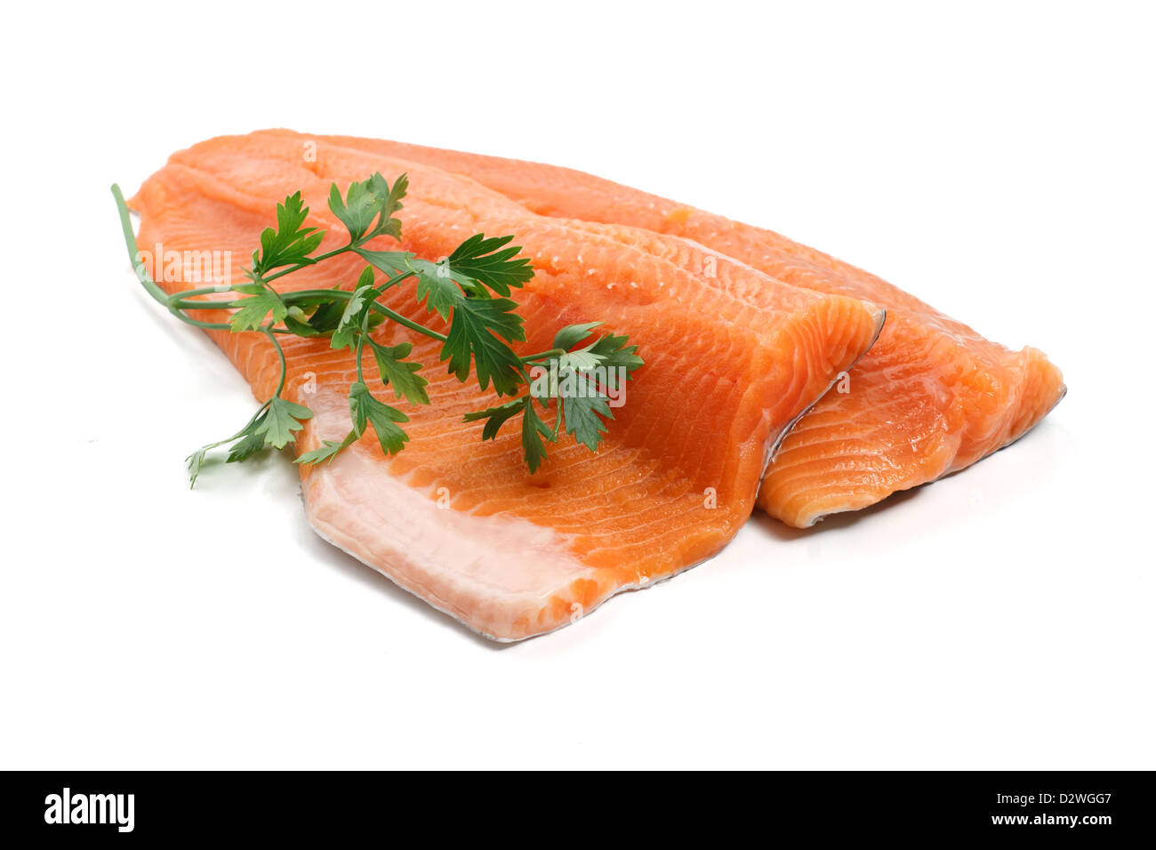 two trout fillets with parsley isolated on white background Stock Photo