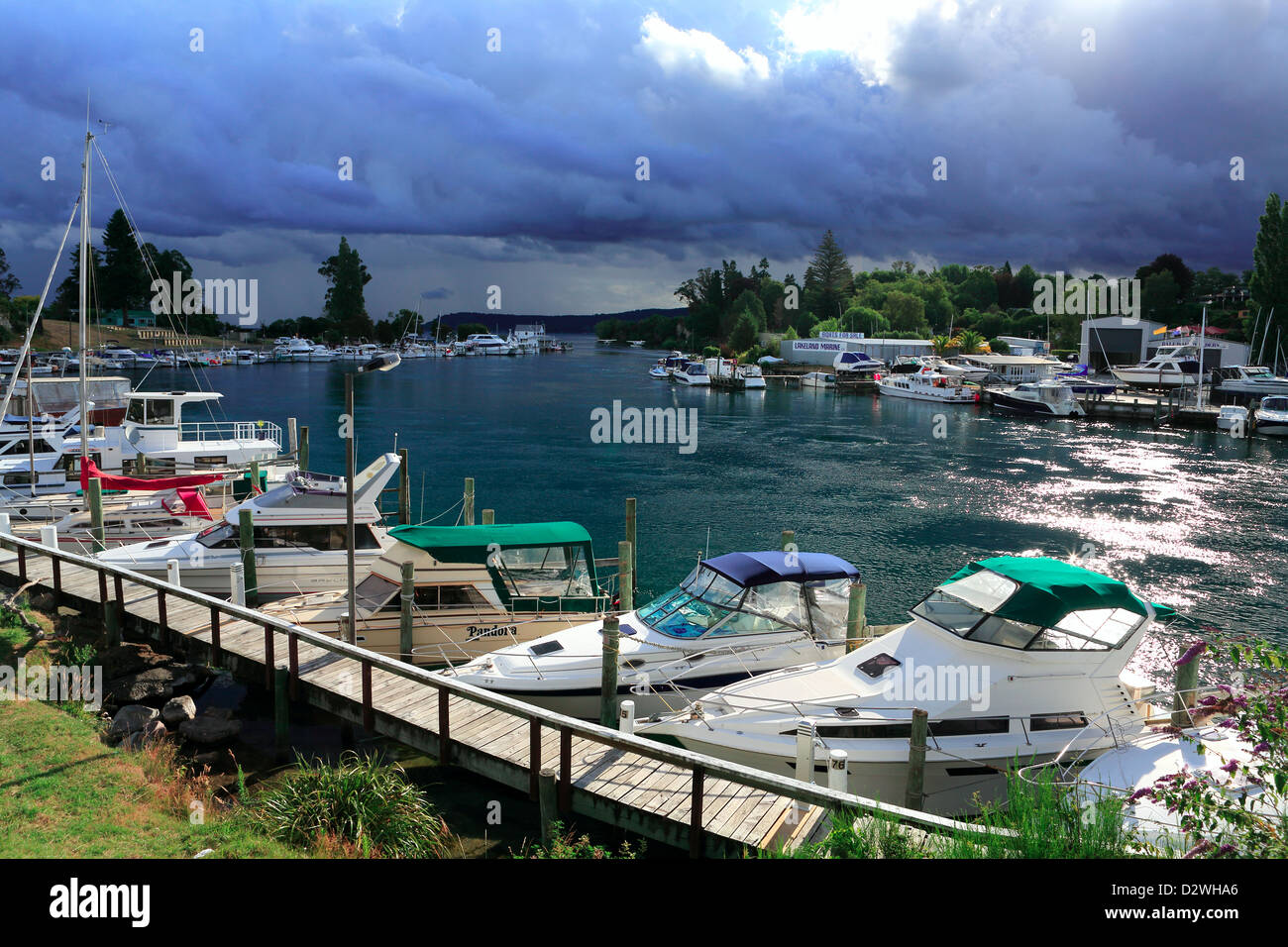 Leisure boats in marina at the head of the Waikato River on Lake Taupo Stock Photo