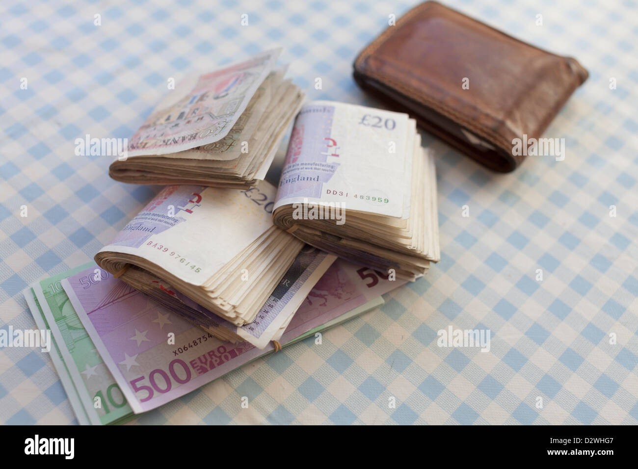 Louis Vuitton wallet filled with cash Stock Photo - Alamy