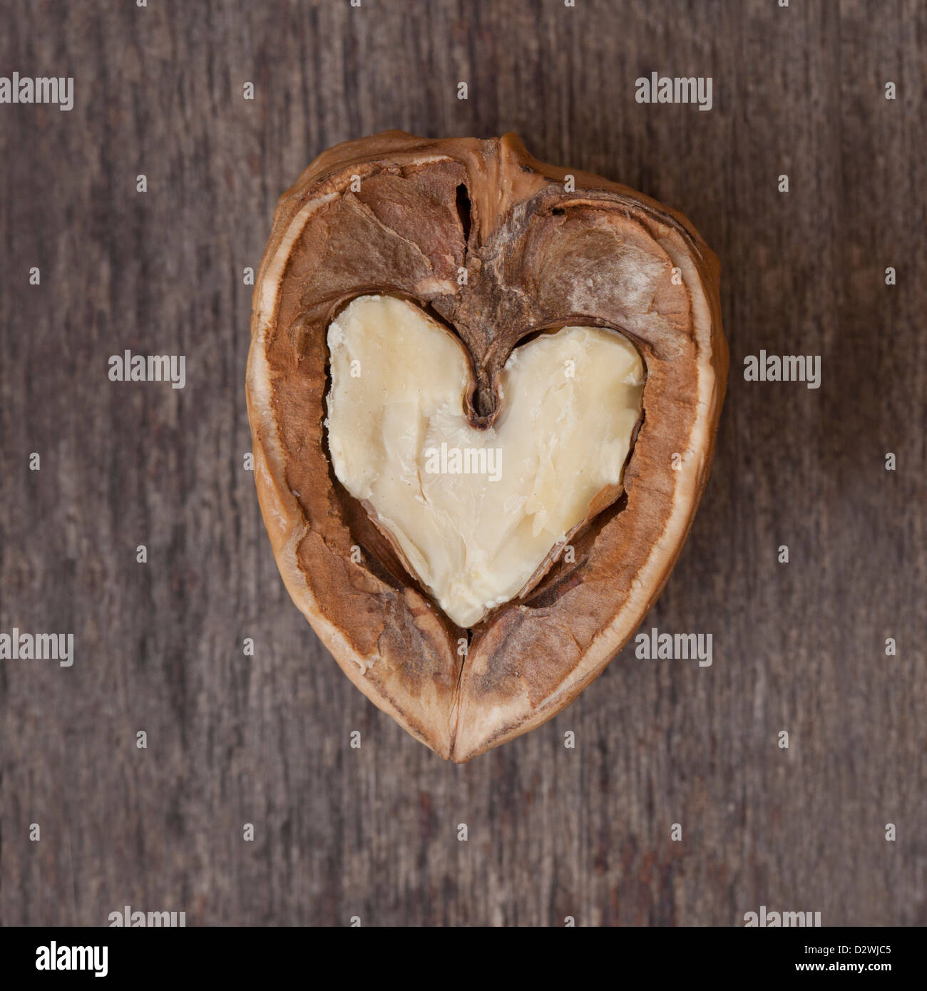 Open walnut with a heart shaped interior. Stock Photo