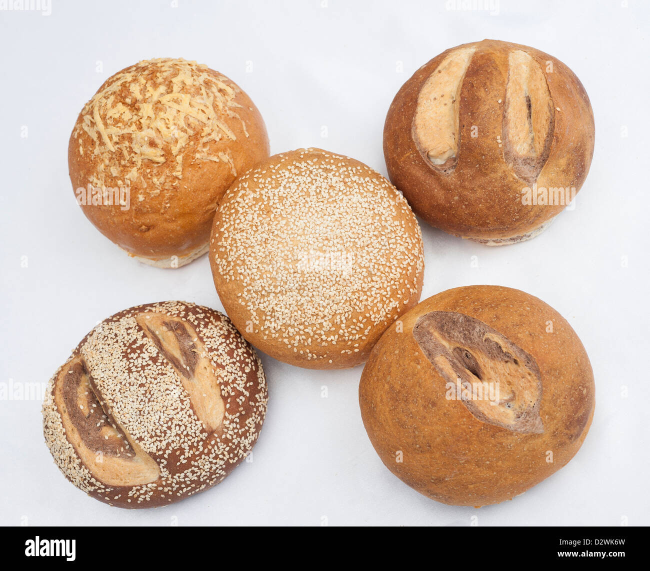 Selection of oriental round bread loaves isolated on a white background