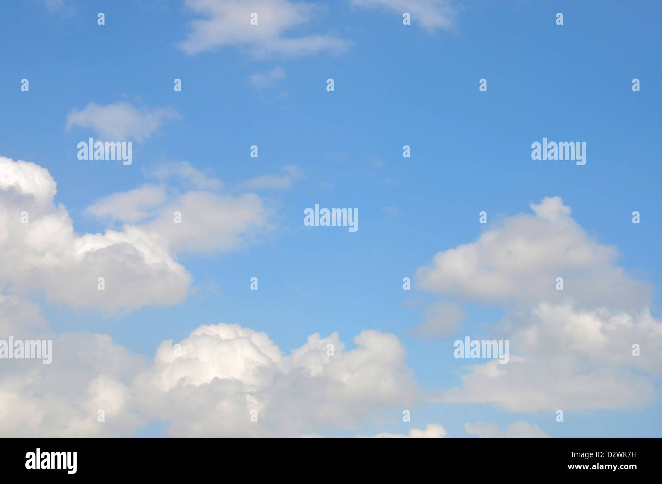 White clouds against a blue sky Stock Photo - Alamy