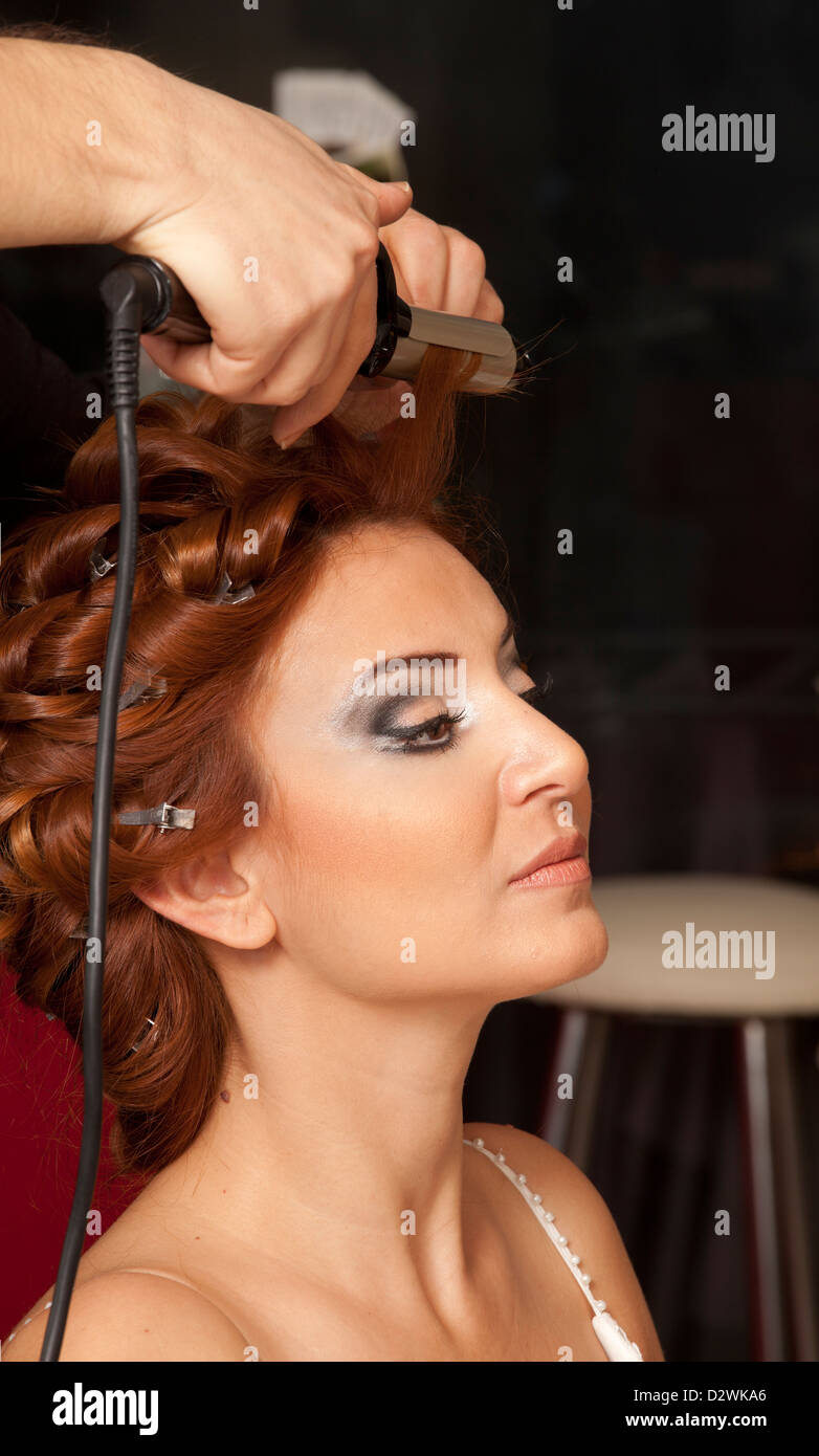 Stylist Pinning Up A Bride S Hairstyle Before The Wedding Stock