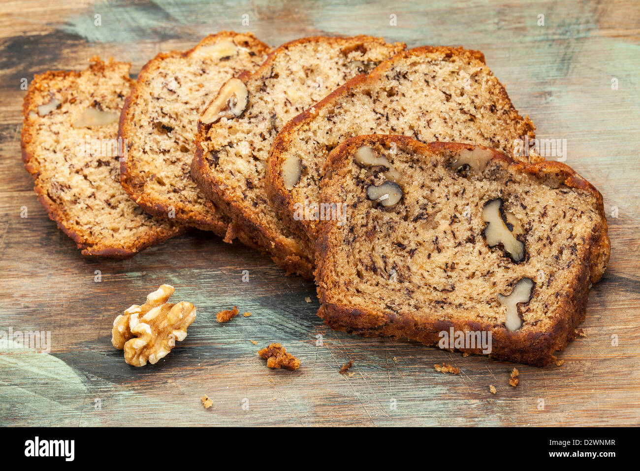 slices of fresh banana bread with walnut on a cutting board Stock Photo