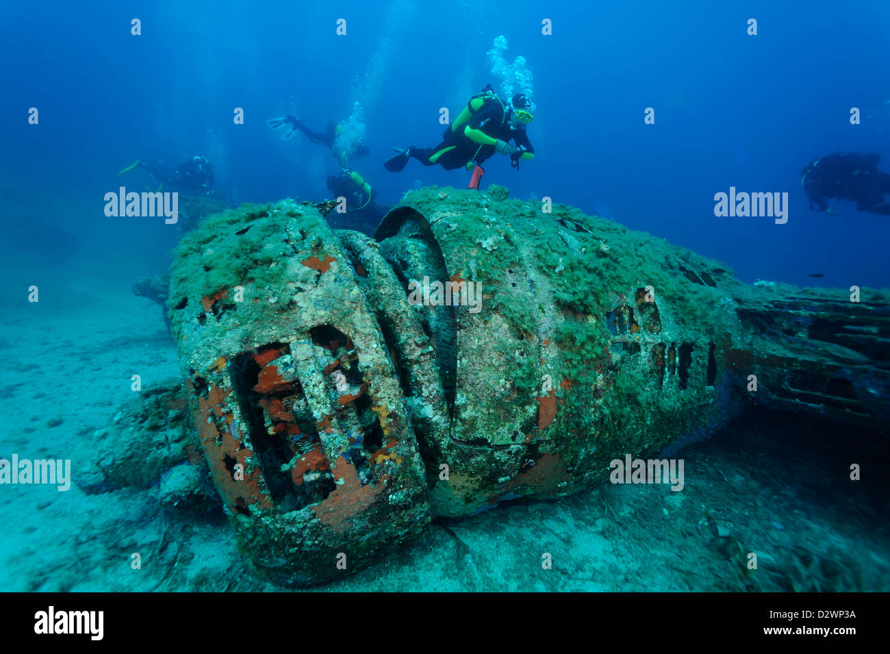underwater view of diver swimming around airplane wreck B 17, Calvi, Corsica, Mediterranean Sea, France Stock Photo