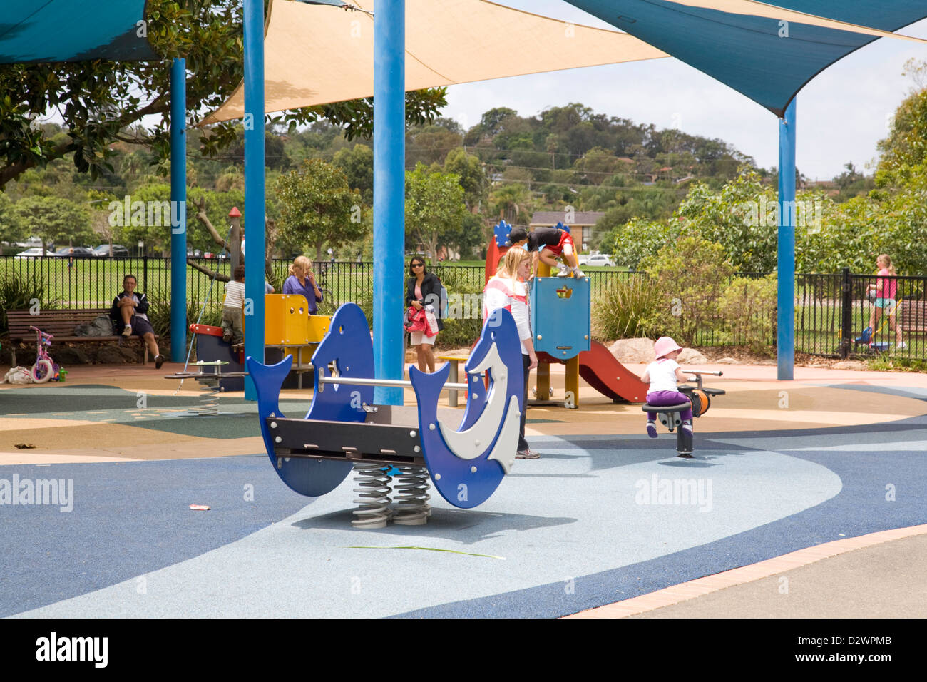 Parents watch their children playing at Mona vale playground,Sydney, Australia Stock Photo