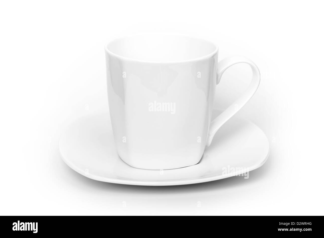 White ceramic cup on saucer above white background Stock Photo