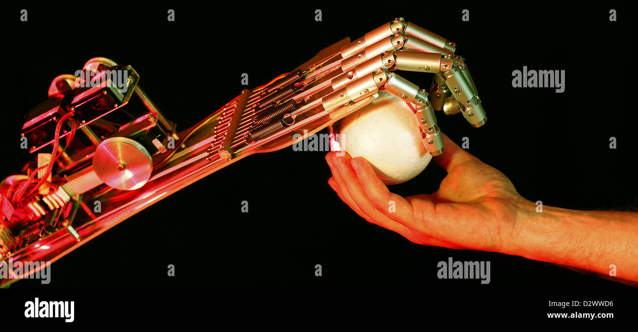 Berlin, Germany, Bionic hand grasping a ball Stock Photo