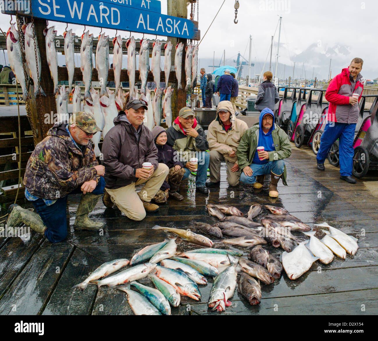 Charter boat fisherman take photographs of themselves with their fresh