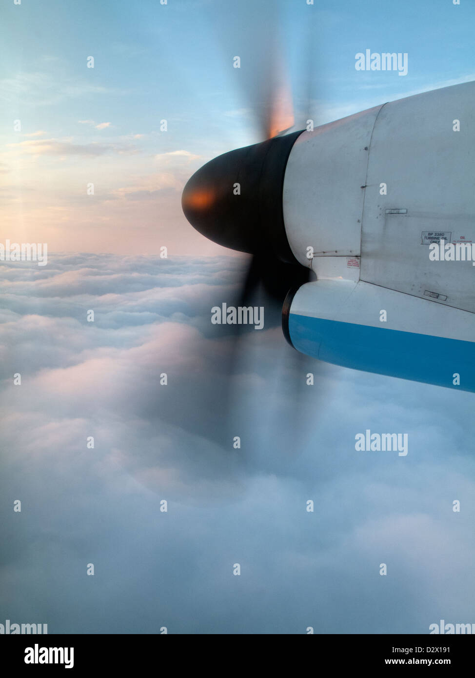 Propeller Jet engine with sunrise taken from inside aircraft Stock