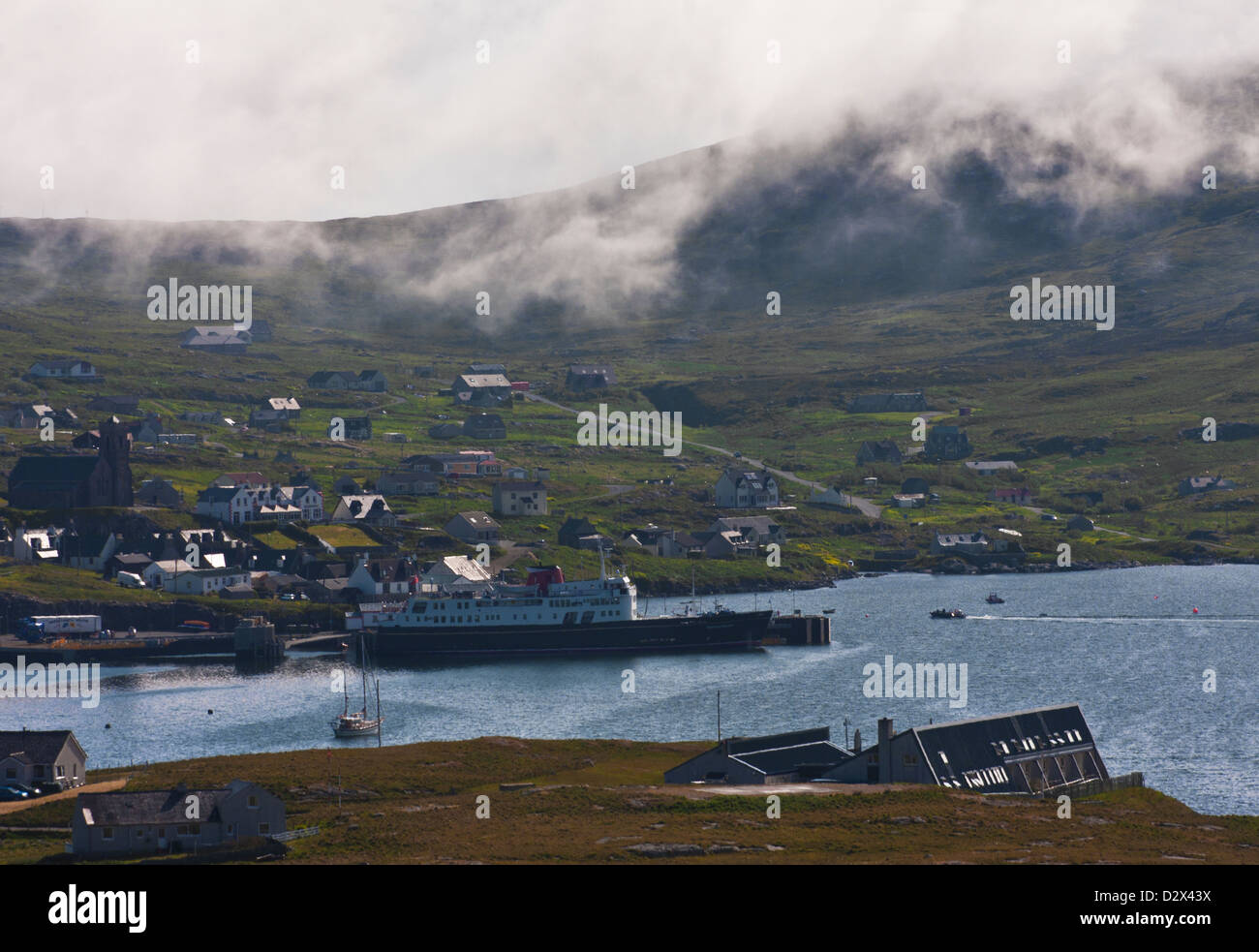 The town of Castlebay sits under Heaval Mountain on the Isle of Barra, Outer Hebrides, Western Isles, Scotland Stock Photo